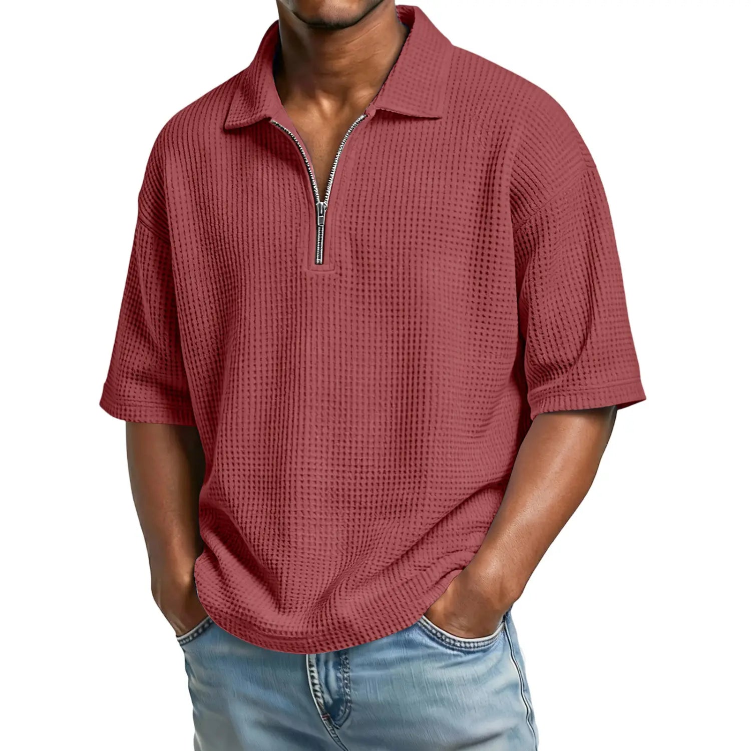 A maroon waffle knit half zip short sleeve polo shirt for men made of textured fabric.