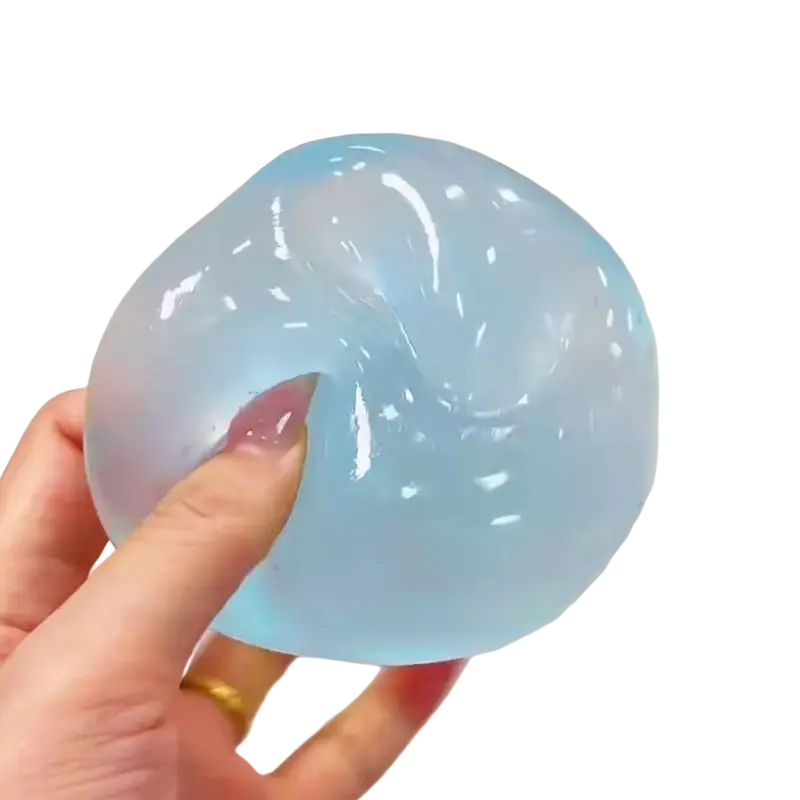 A translucent light blue fidget toy stress ball made of tpr material infused with coconut oil for stress relief