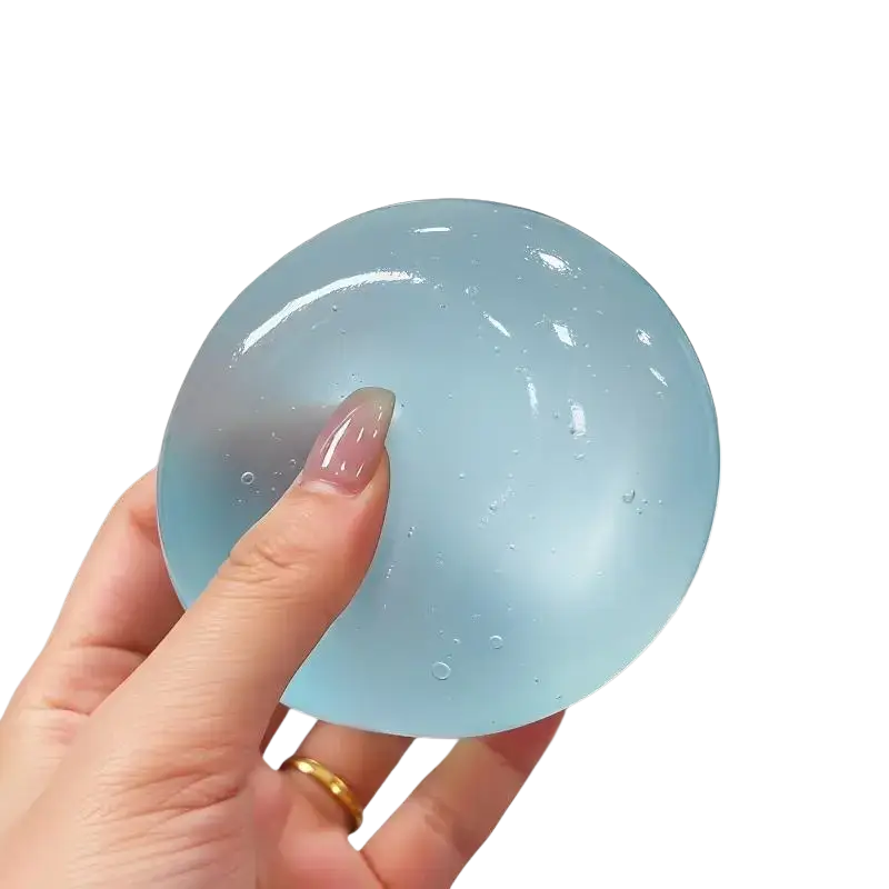 A translucent light blue tpr material fidget toy stress relief ball with coconut oil and small embedded bubbles