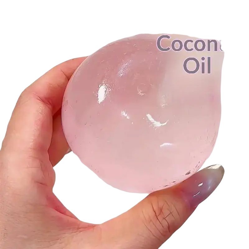 A translucent pink spherical fidget toy made of soft stretchy tpr material infused with coconut oil for stress relief