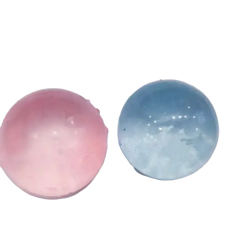 Two translucent spherical beads in soft pink and light blue made of tpr material for coconut oil fidget toy stress relief