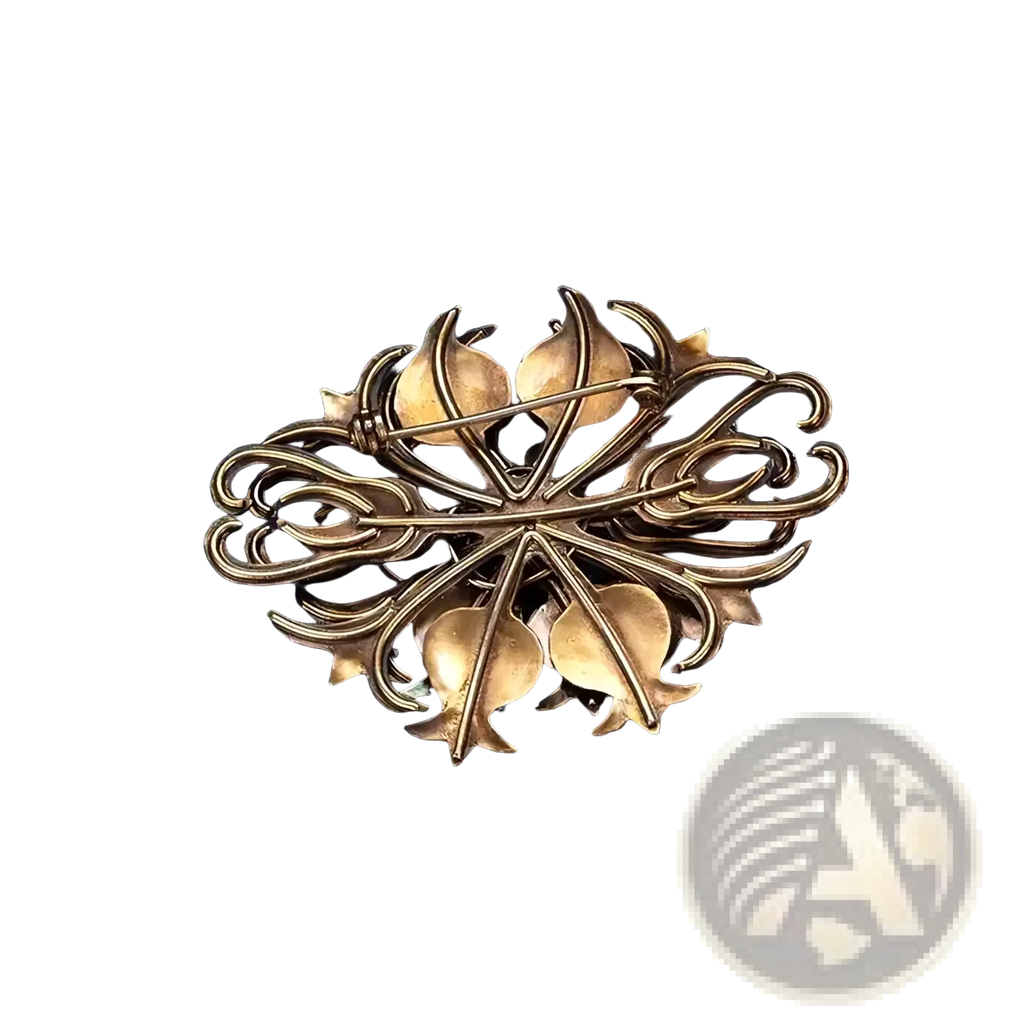 Antique brass-colored filigree brooch with intricate leaf and vine design from turquoise floral palace jewelry collection