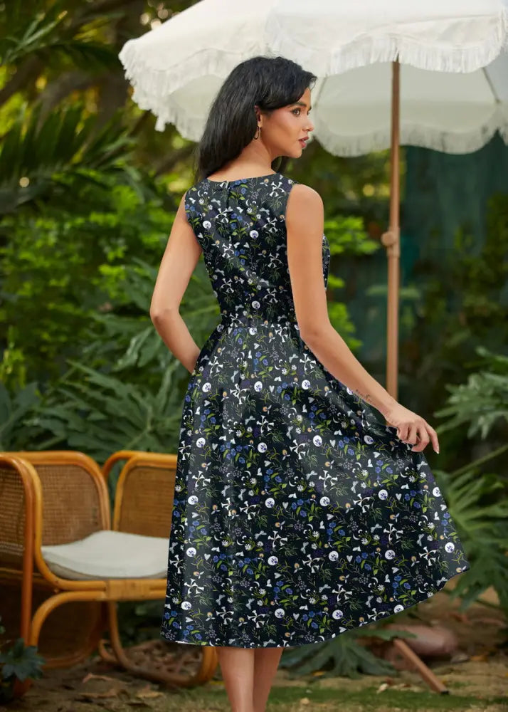 Firefly navy floral cotton 1950s style midi dress with pockets featuring a fitted bodice and flared skirt with blossoms