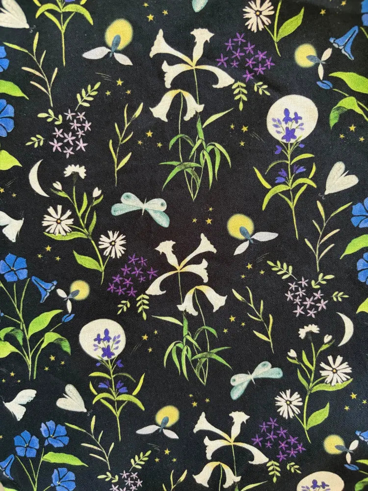 Firefly navy floral cotton 1950s style midi dress with pockets featuring black fabric with whimsical floral and celestial pattern