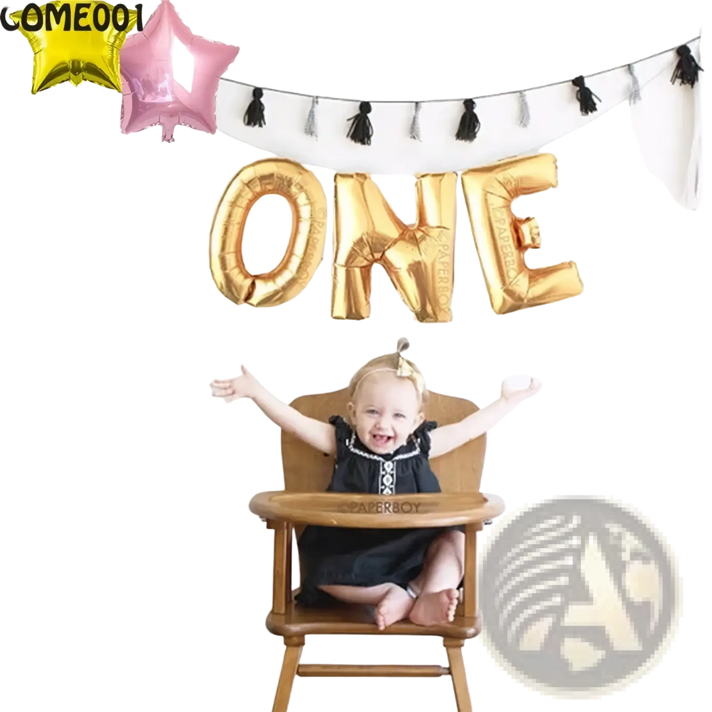 Gold foil balloon letters spelling one hanging above a baby in a high chair as first birthday party bunting decoration