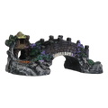 Black and gray resin fish tank landscaping bridge with miniature stone arch, thatched-roof hut, foliage, and purple flowers