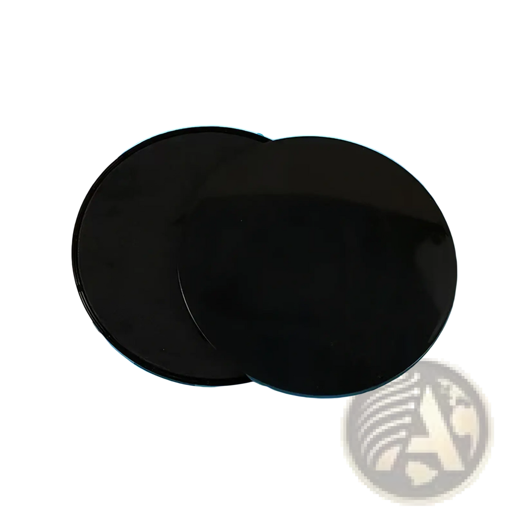 Two overlapping black circular glass fitness core sliders with a glossy finish for abdominal training
