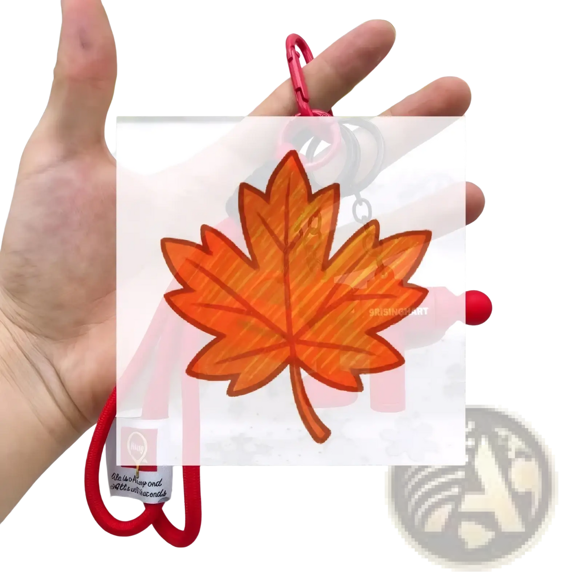Orange maple leaf-shaped fitness dumbbell keychain with red carabiner and cord for gym bag charm accessories