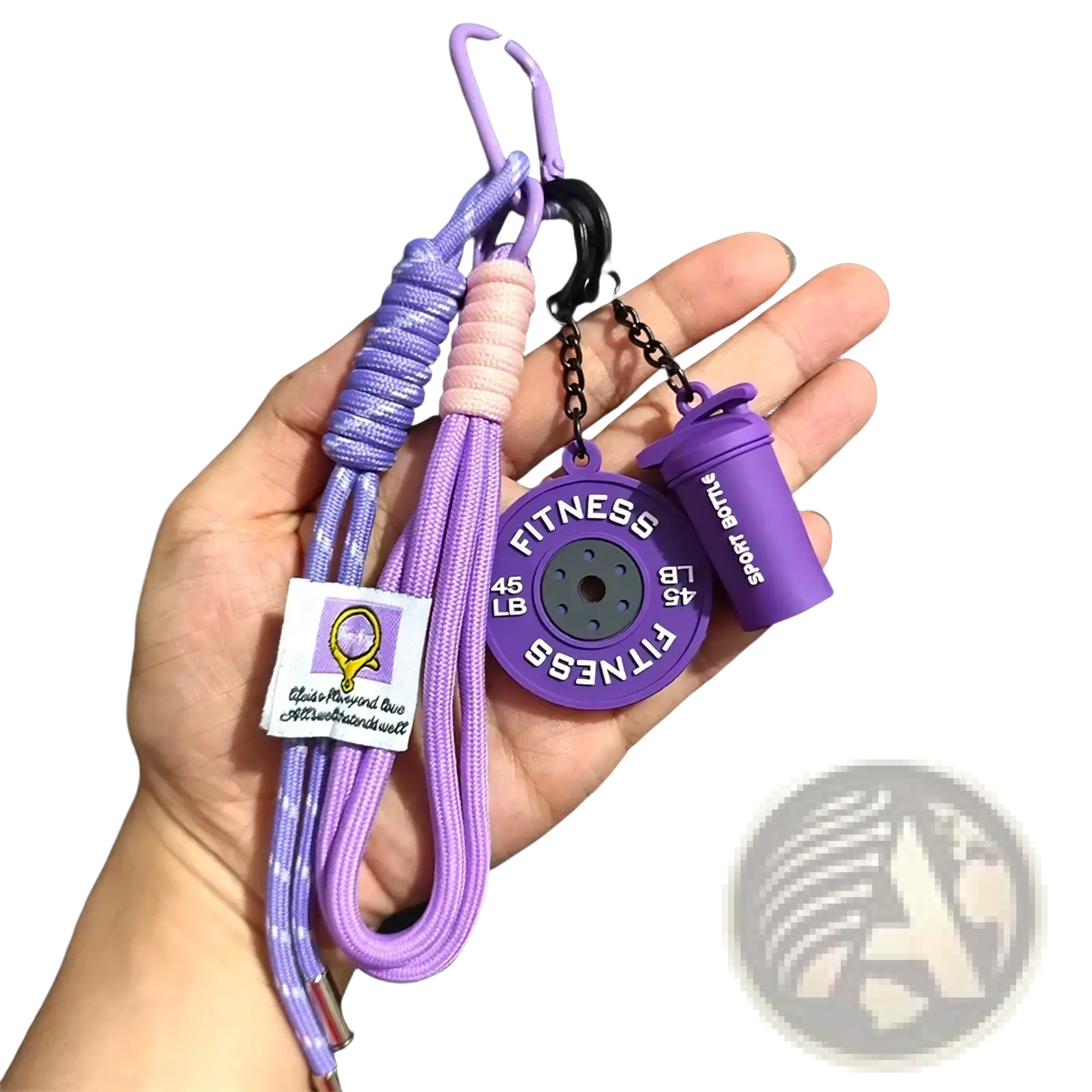 Purple silicone fitness keychain with 45 lb weight plate charm and shaker bottle on braided cord with carabiner clips