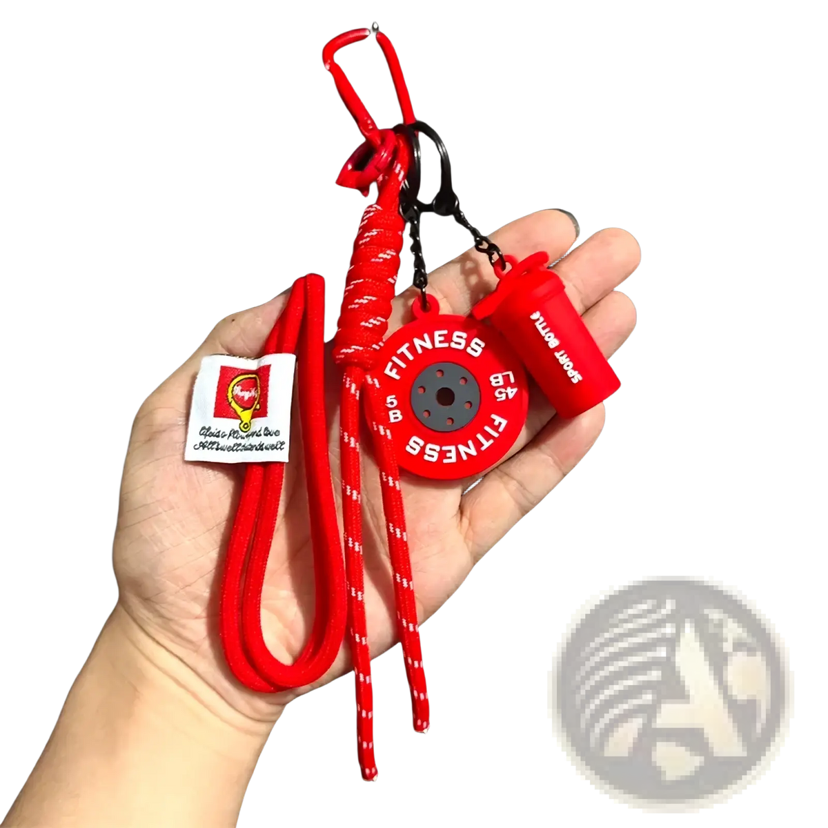 Red silicone fitness keychain with circular weight plate charm and small shaker bottle accessory for gym bags