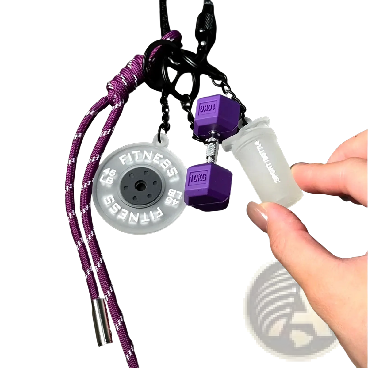 Purple and black fitness keychain with circular weight plate, miniature dumbbell, and shake bottle gym bag charms