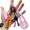 Fitness keychain mini gym equipment bag pendant with pink and black hand grip exerciser and orange resistance bands