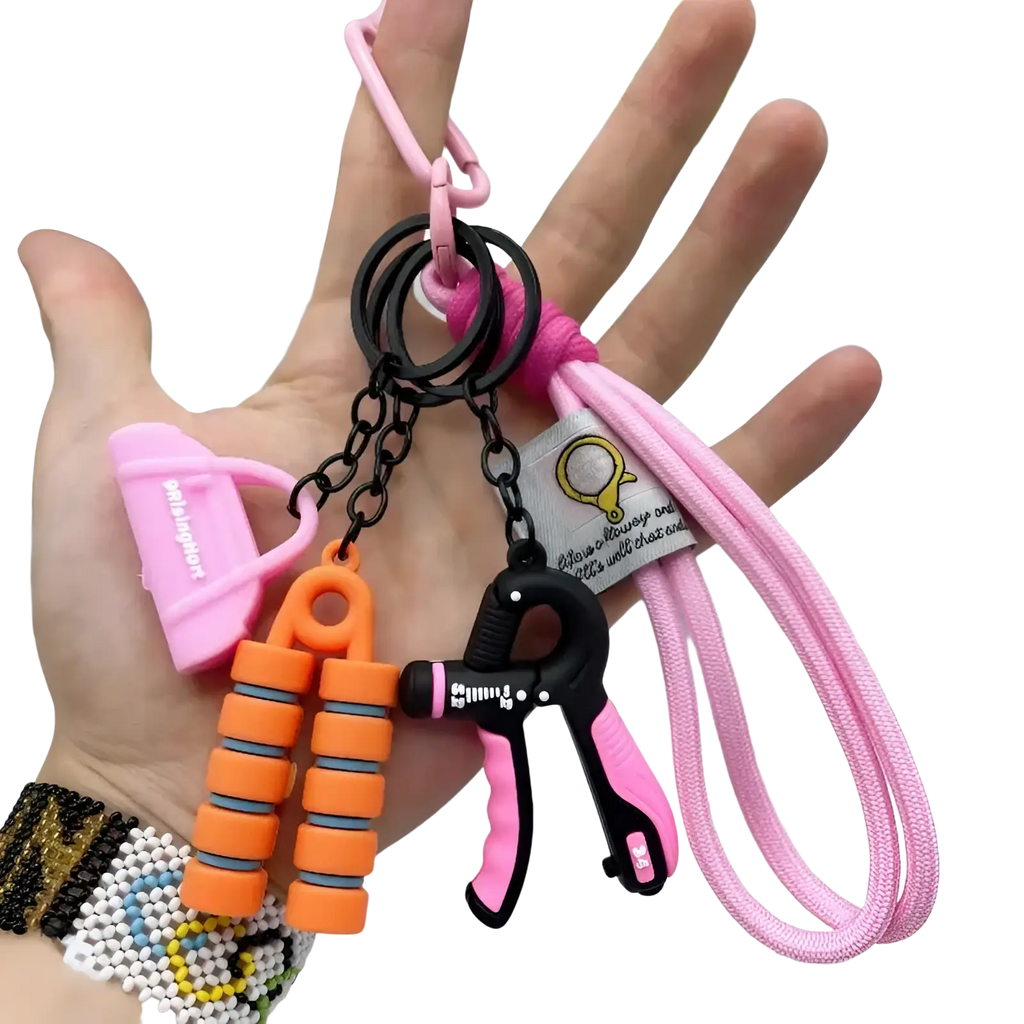 Fitness keychain mini gym equipment bag pendant with pink and black hand grip exerciser and orange resistance bands