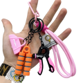 Fitness keychain mini gym equipment bag pendant with pink and black hand grip exerciser and orange resistance bands