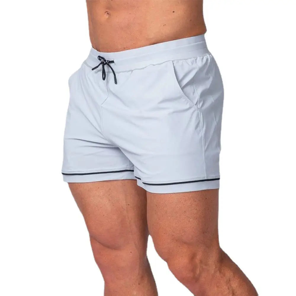 Men’s light blue quick-dry 2-in-1 athletic shorts with black drawstring and trim for multi-sport performance