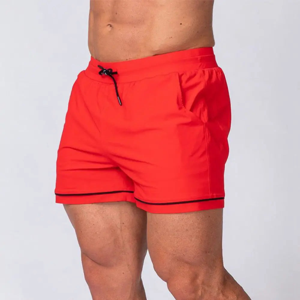 Men’s quick-dry 2-in-1 multi-sport performance shorts in bright red with black trim and drawstring closure for athletic use