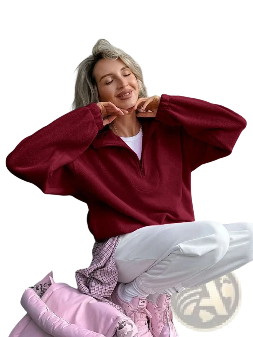 A cozy maroon fleece half zip sweatshirt with long sleeves designed as a loose casual pullover