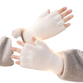 Fleece-lined fingerless gloves for women in soft white knitted fabric with a fuzzy texture worn over gray fleece jacket
