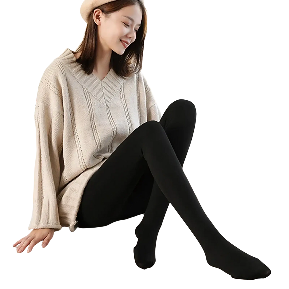 A woman sitting on a wooden surface wearing black opaque fleece lined high waist thermal tights