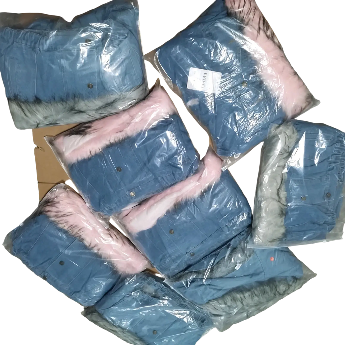 Fleece lined hooded denim jackets in blue with pink and gray faux fur collars packaged in clear plastic bags
