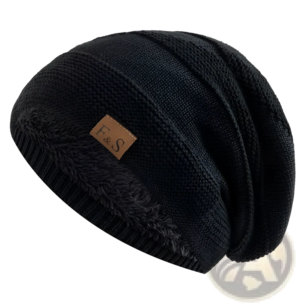 Fleece lined knitted beanie cap in black with a fuzzy interior and brown leather patch featuring the f&s logo