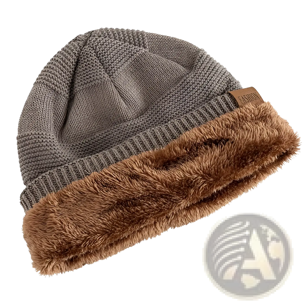 Fleece lined knitted beanie cap in gray knit with plush brown faux fur trim and small leather tag for warmth and style