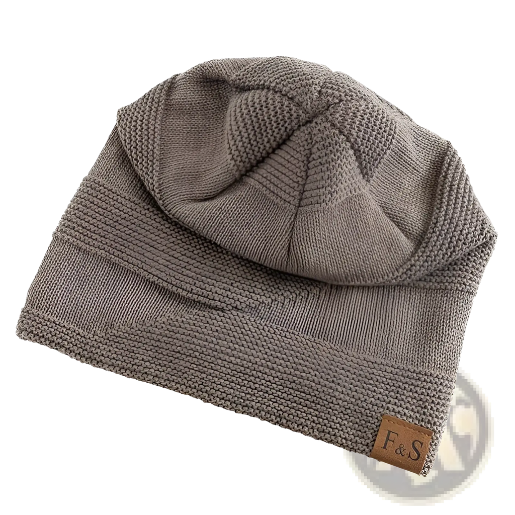 Taupe fleece lined knitted beanie cap with ribbed brim textured crown and small brown leather patch on the side