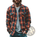 A man wearing a fleece-lined plaid men’s flannel shirt in red and teal with two chest pockets