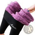 Purple fleece lined high waist leggings with black ribbed exterior and menaiq branding for winter warmth
