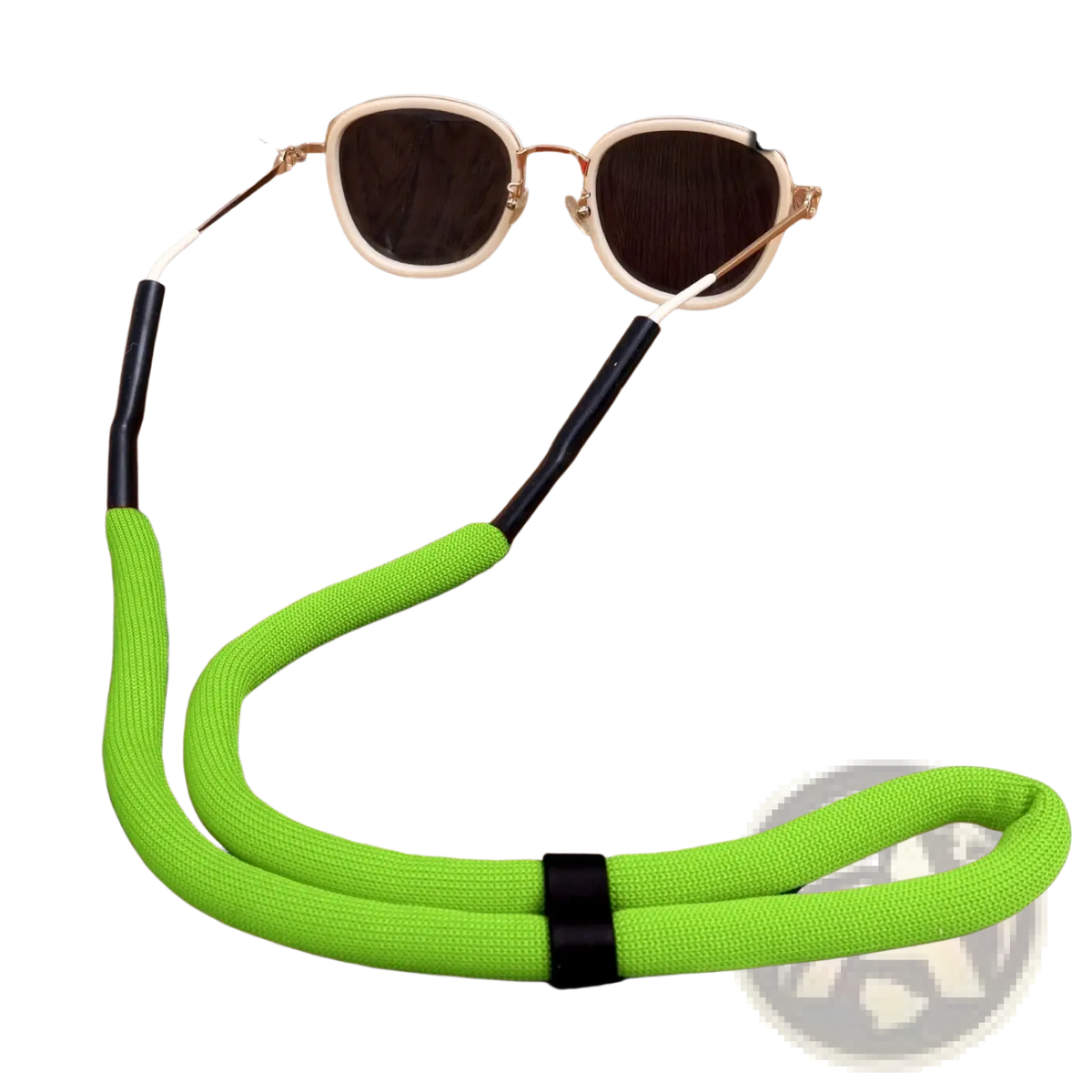 Bright green textured fabric floating eyeglass strap with black plastic ends and central fastener for water sports