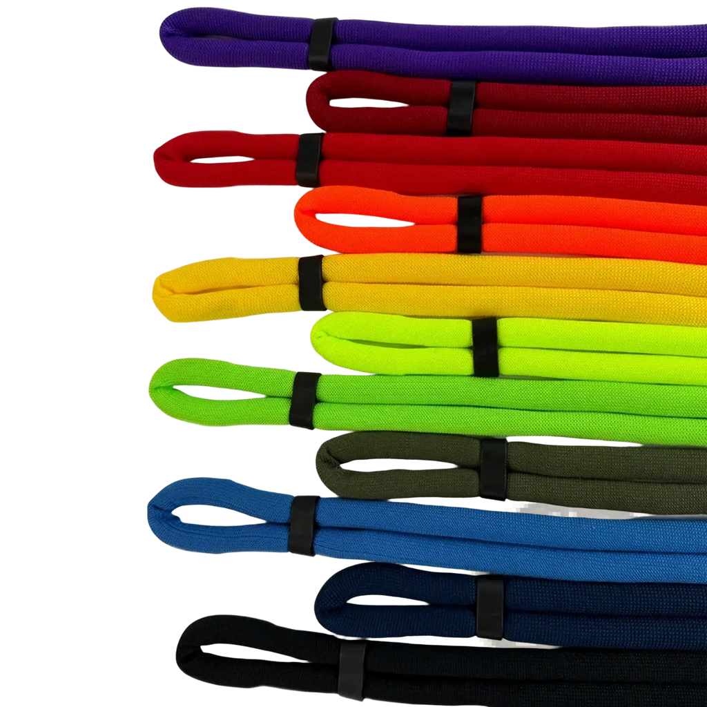 A vibrant rainbow-colored fabric floating eyeglass strap with black plastic clip designed for water sports use