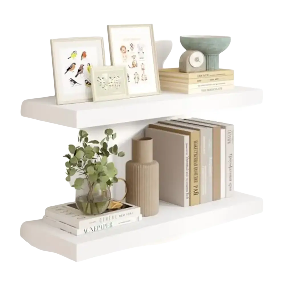 White wooden floating shelves with a minimalist design holding framed artwork and decor for living room display