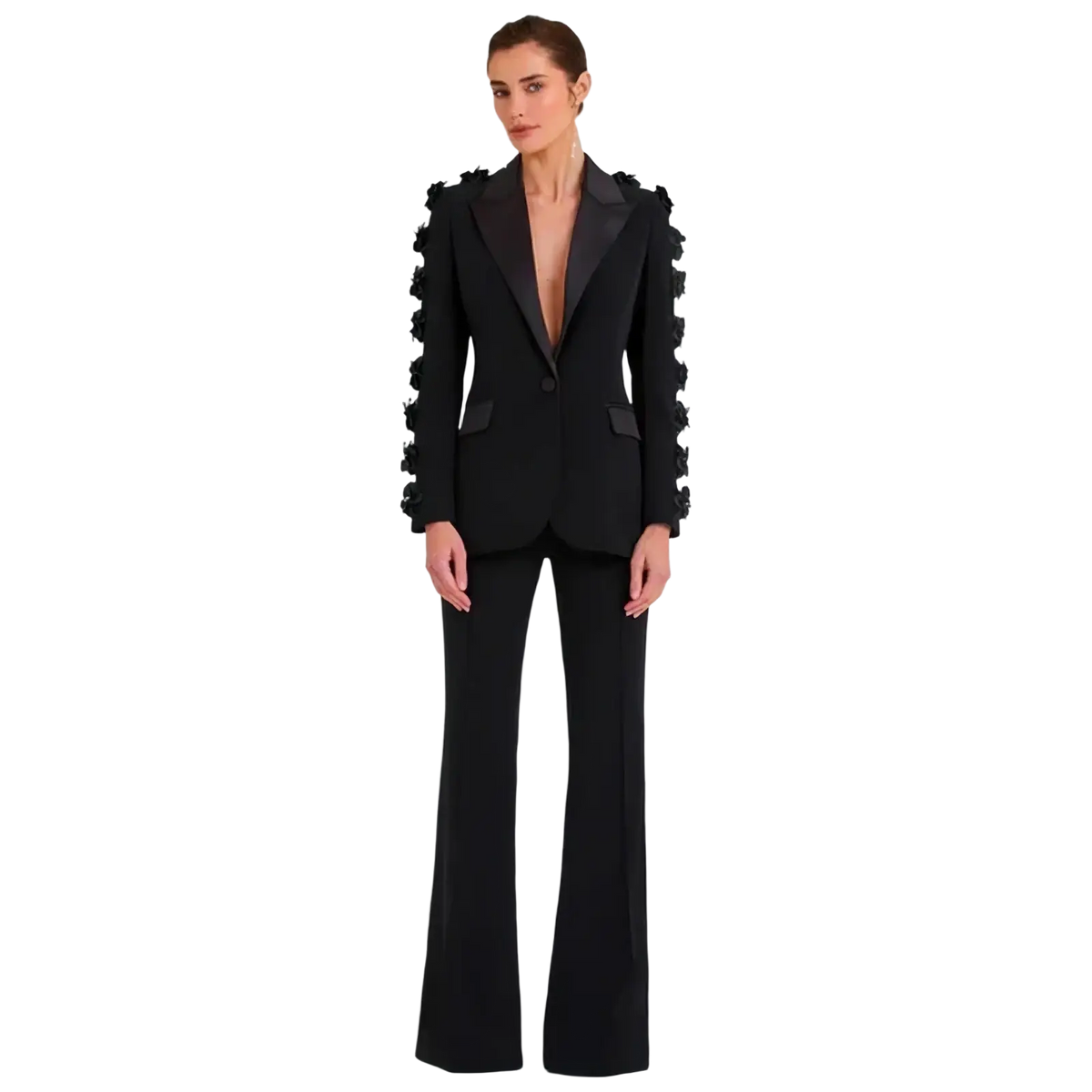 Black tailored pant suit with floral 3d applique embellishments on blazer shoulders and sleeves paired with flared trousers