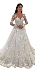 A white lace wedding gown with long sheer sleeves and floral appliqués for bridal occasions