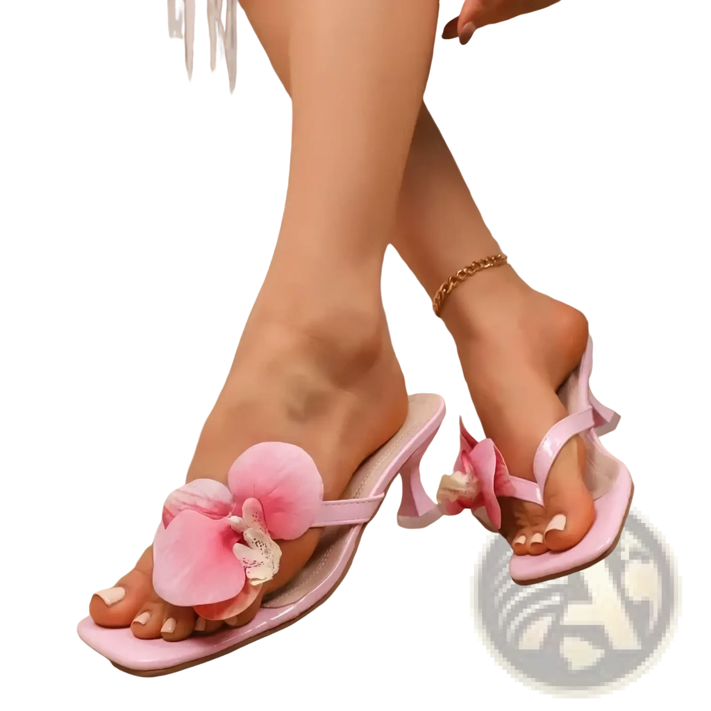 Floral block heel mule sandals with pink orchid adornment, satin strap, and square toe for elegant wear