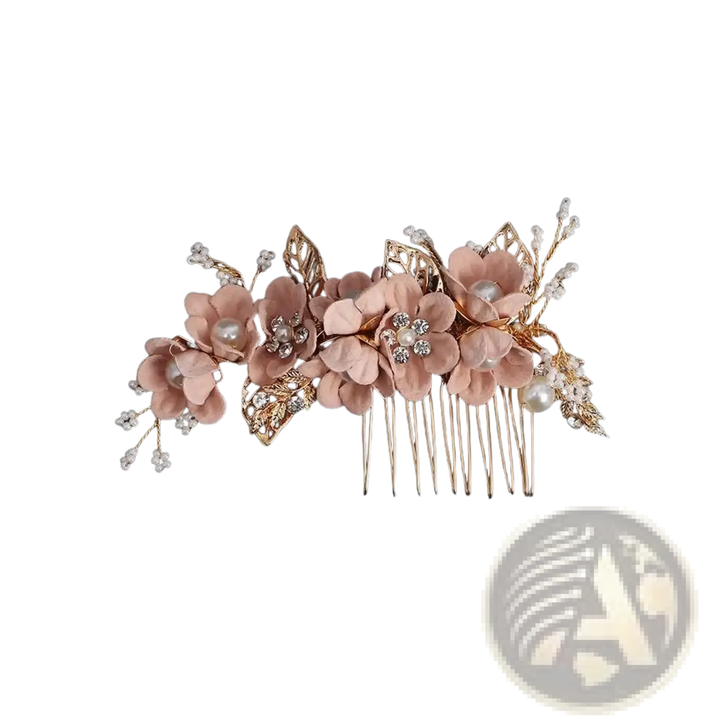 A delicate rose gold floral bridal hair comb with soft pink fabric flowers pearl accents and crystal details
