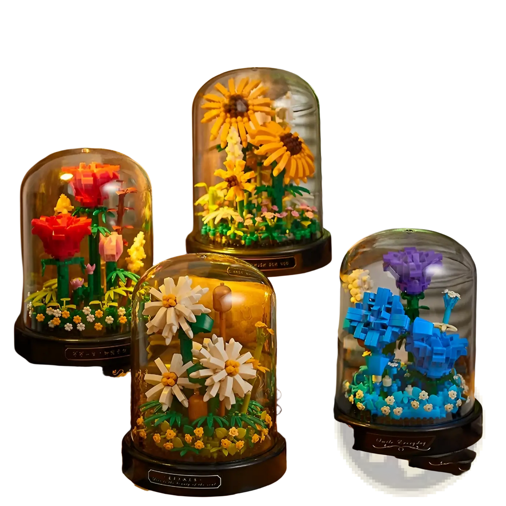 Four glass domed display cases each featuring a floral building block bouquet with colorful lego flowers and greenery