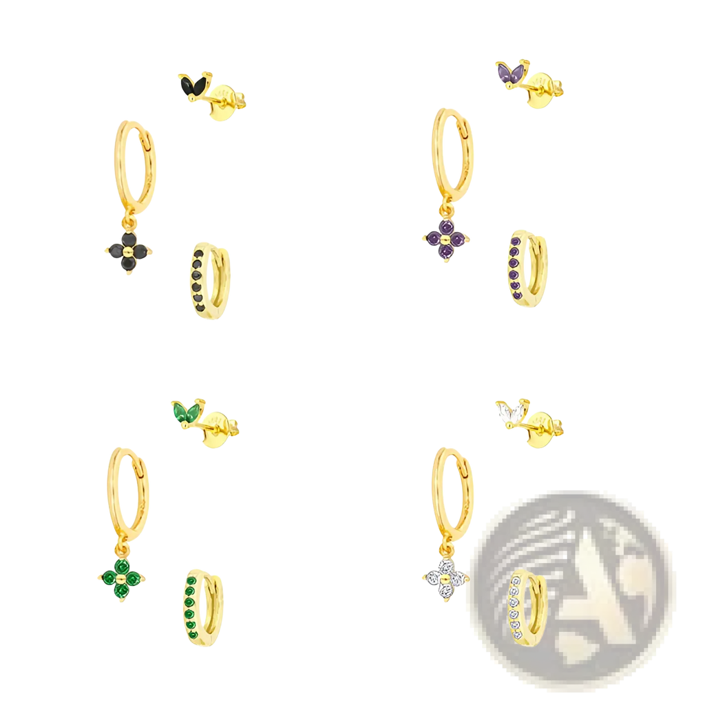 Gold-toned floral and butterfly huggie hoop earrings with dangling black purple green and clear gemstone charms