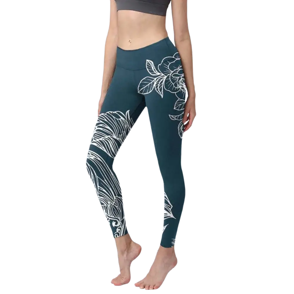 Teal high waisted yoga leggings with white floral and leaf patterns featuring a butterfly print design