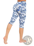 White floral capri yoga leggings with blue pattern designed for comfortable activewear use