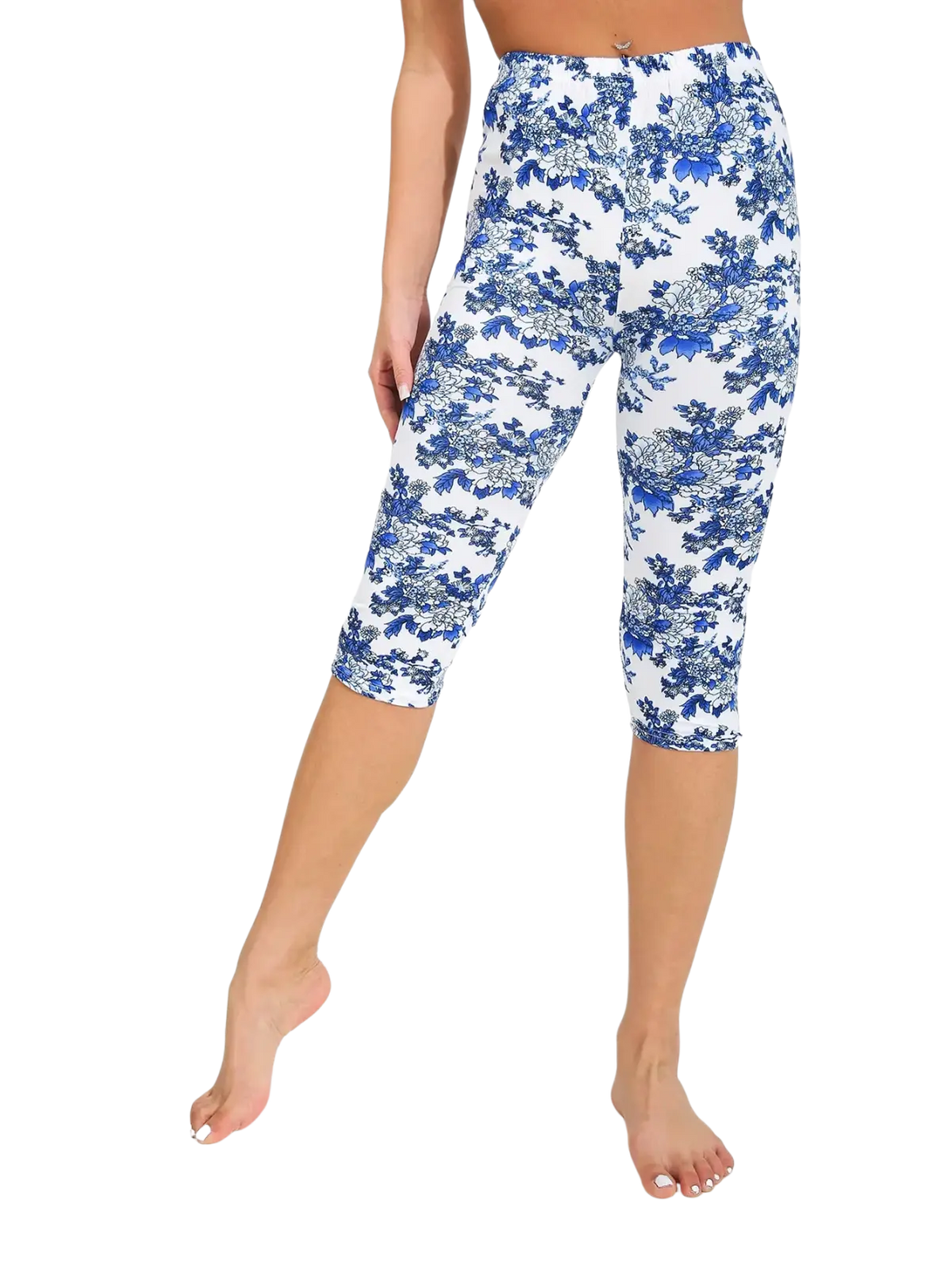 White capri yoga leggings featuring a detailed blue floral pattern ideal for active wear and comfort