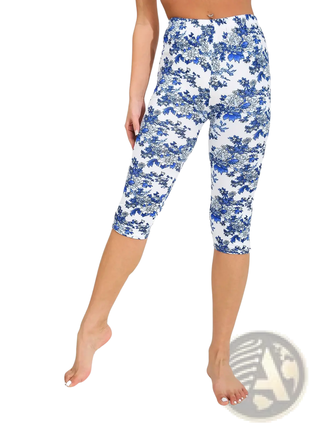 White capri yoga leggings featuring a detailed blue floral pattern ideal for active wear and comfort