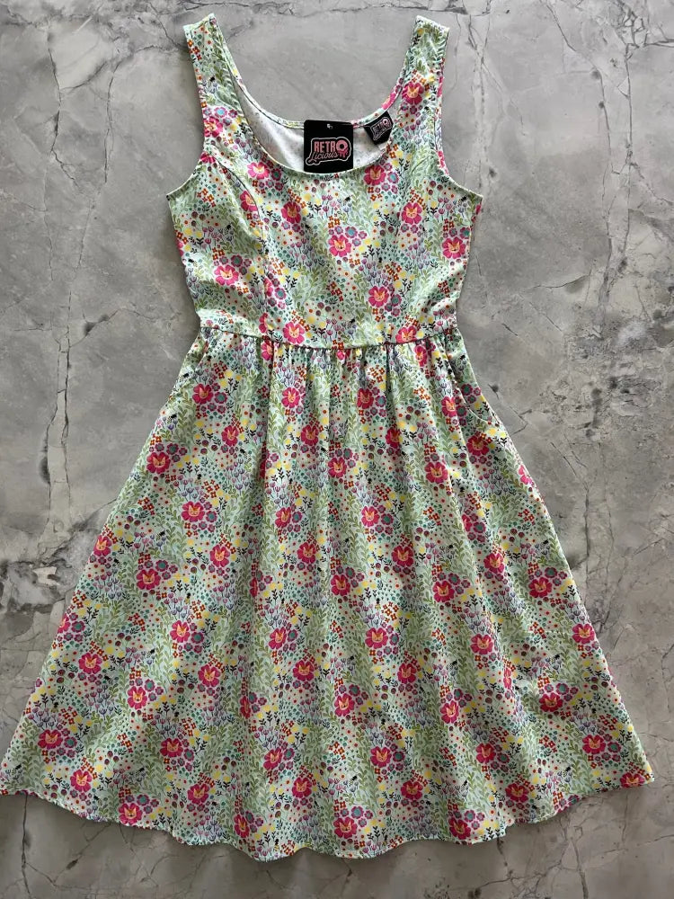 Floral Cats light green cotton sleeveless dress with gathered waist ruffled hem and small multicolor floral print