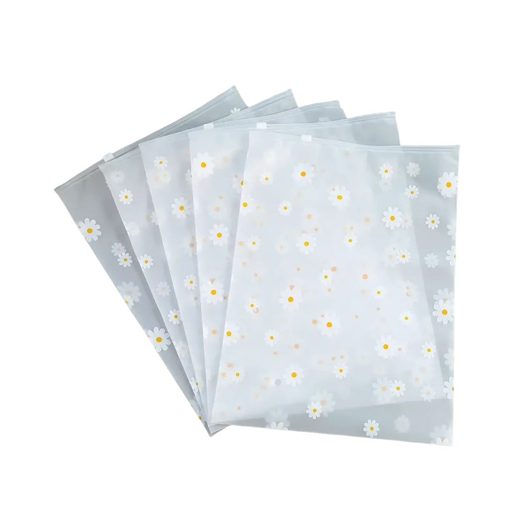 Floral clear travel cosmetic bag with clear plastic file folders featuring white daisy patterns and transparent zippers
