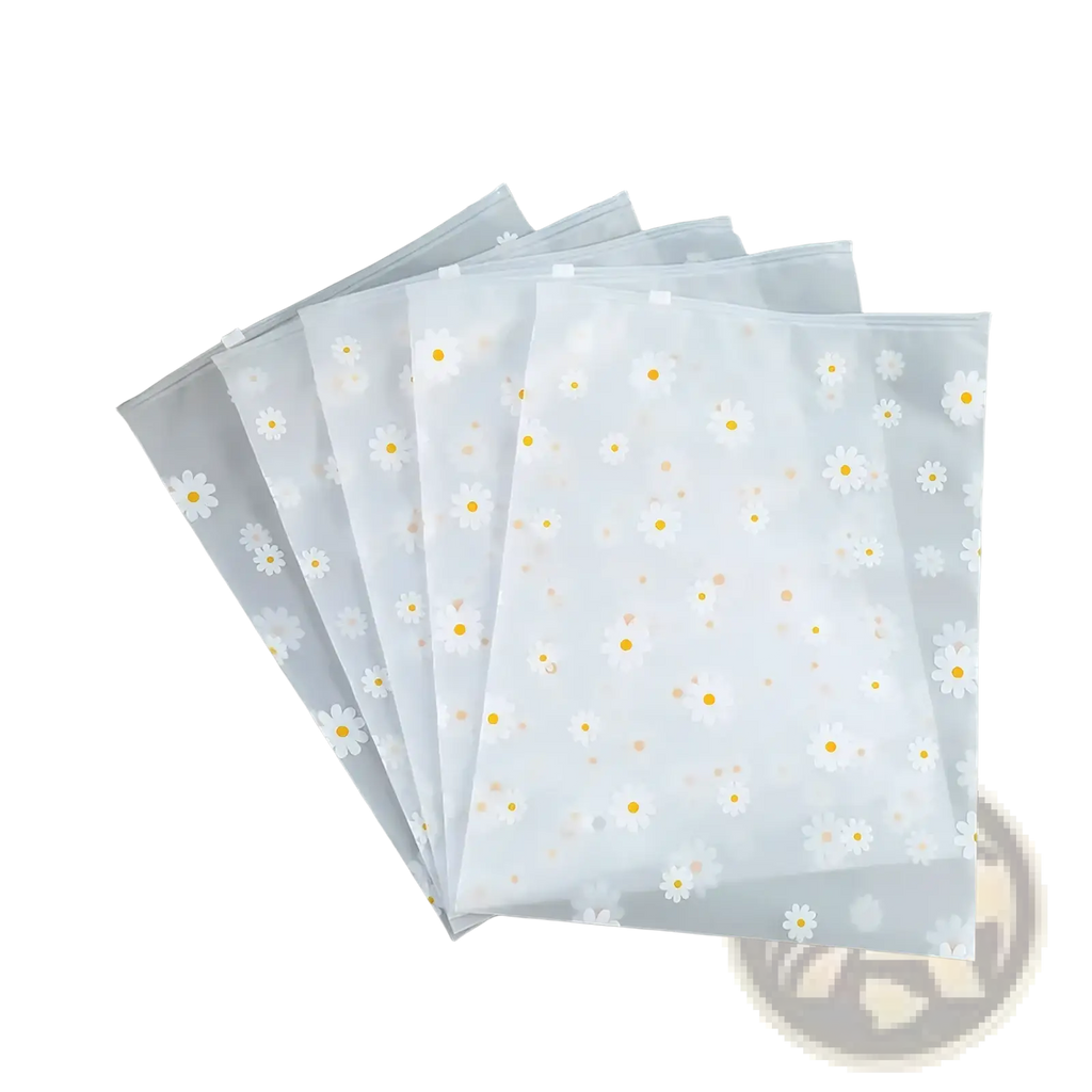 Floral clear travel cosmetic bag with clear plastic file folders featuring white daisy patterns and transparent zippers
