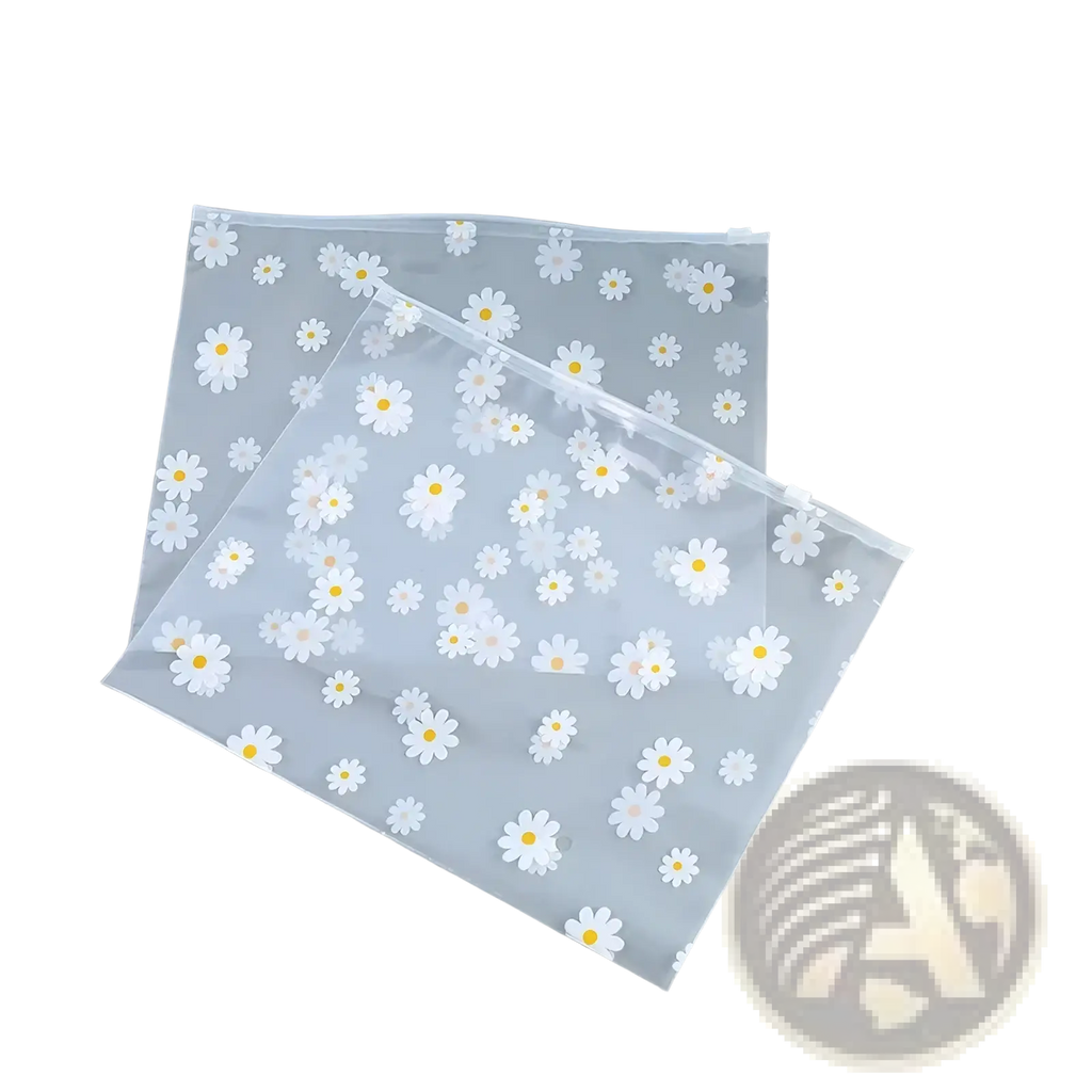 Floral clear travel cosmetic bag made of clear plastic with white daisies and yellow centers zip-top closure