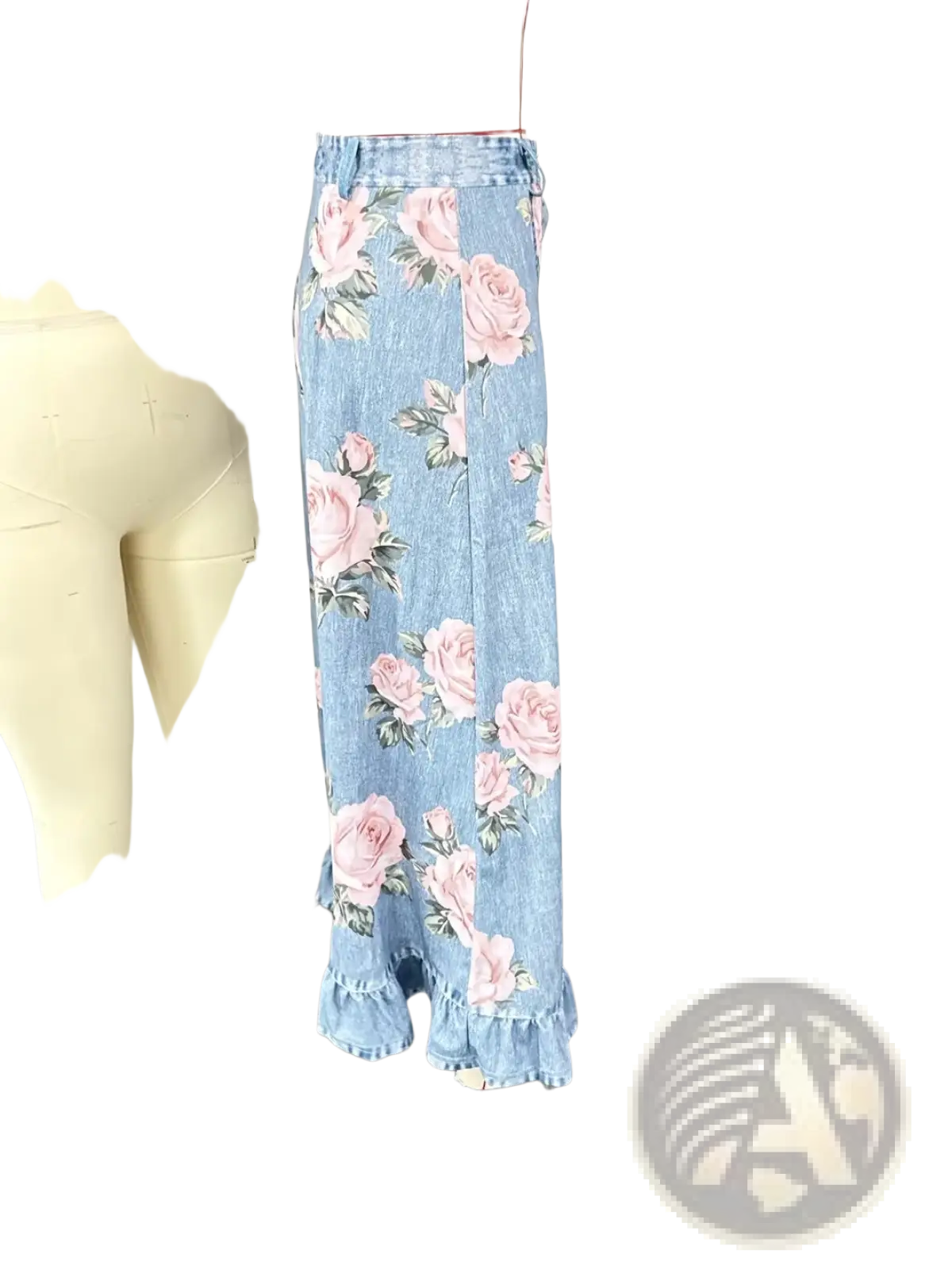 A light blue denim floral peplum skirt with pink roses green leaves and a ruffled hem for stylish wear