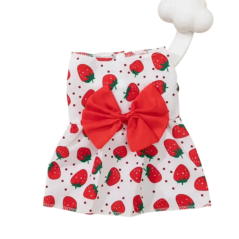 White swimsuit with strawberry pattern and large red bow at front designed as floral dog princess dress with bow