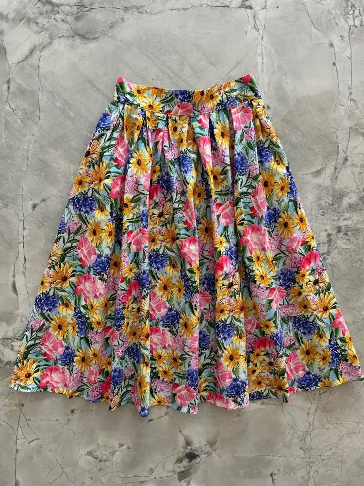 Floral Doris retro cotton midi skirt with pockets in a vibrant sunflower and multicolor floral a-line print on light fabric