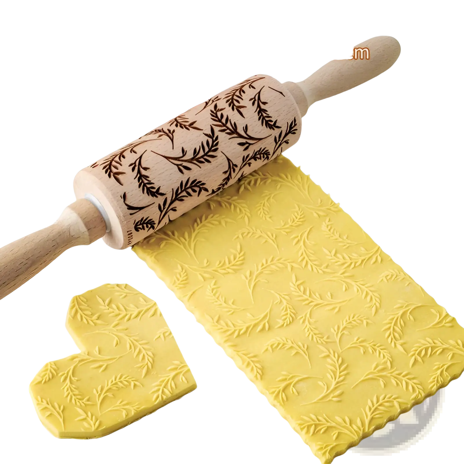 A floral embossed beech wood rolling pin with dark brown leaf pattern engraving on yellow dough for baking